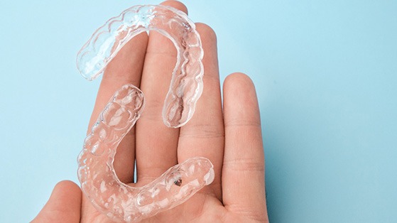 Transparent trays on the palm of a hand