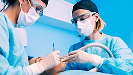 Dentists performing surgery