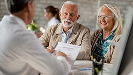 elderly couple at a consultation with their dentist 