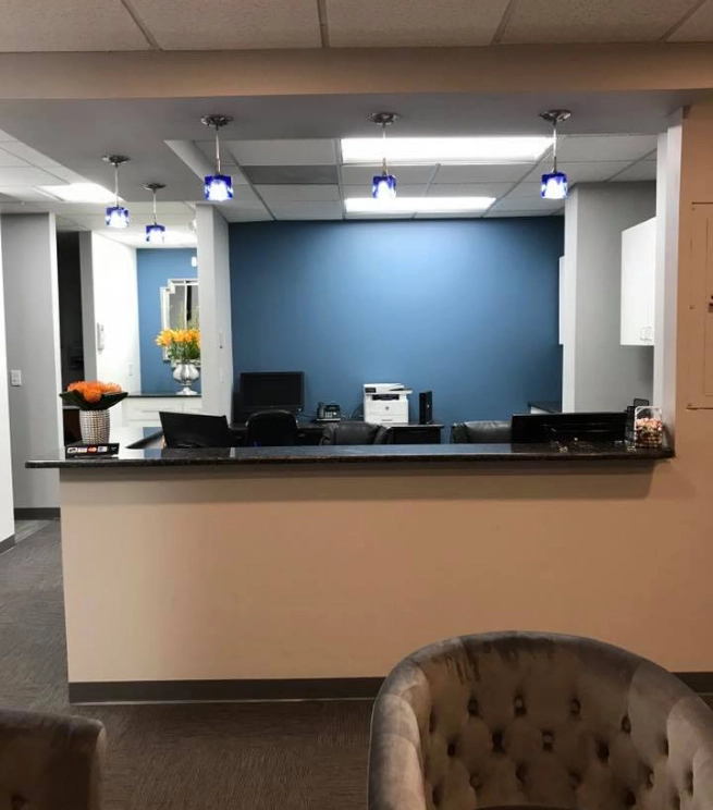 Front desk and reception area at Schumacher Dental