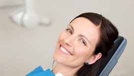 Smiling woman in the dental chair