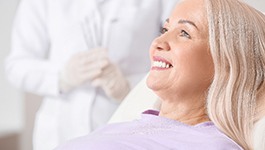 patient smiling while visiting dentist 