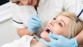 Woman visiting an emergency dentist in Wakefield for an exam