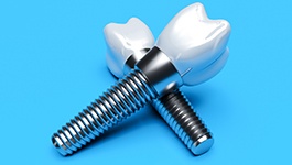 Two dental implants on a blue background