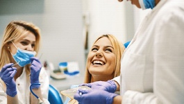 Woman smiling at her dentist during a dental checkup