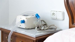 C P A P machine on bedside table