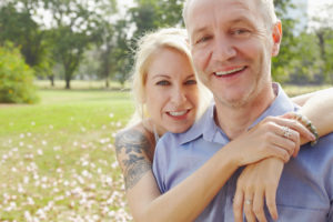 middle aged couple embracing