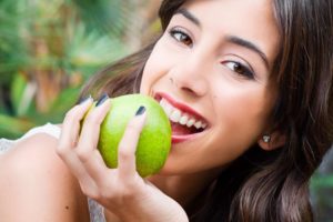 woman eating apple