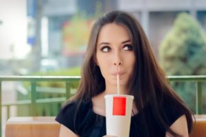 woman sipping soda