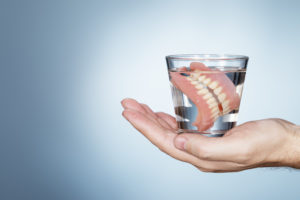 dentures soaking in water