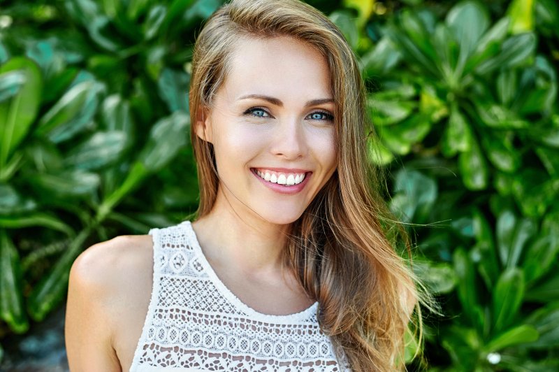 woman enjoying the benefits of smiling in Wakefield