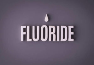Fluoride on dark purple background