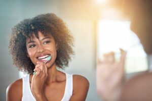 Woman brushing her teeth. 